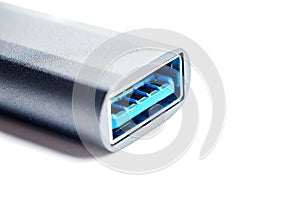 Close-up of a USB 3.0 connector on a white background, ready for data transfer