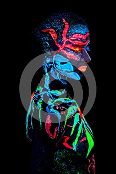 Close up UV portrait of a bodyart flamengo