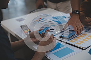 Close up ux developer and ui designer use augmented reality brainstorming about mobile app interface wireframe design on desk at