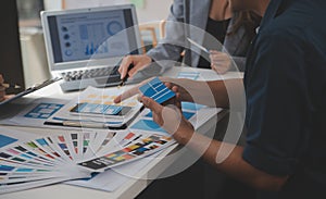 Close up ux developer and ui designer use augmented reality brainstorming about mobile app interface wireframe design on desk at