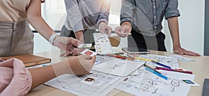 A close-up of an ux ui developer and an ui designer working on a mockup icon interface for a mobile app