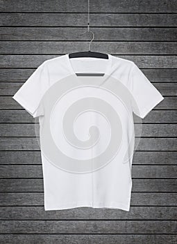 Close up of a V shape white t-shirt on cloth hanger.