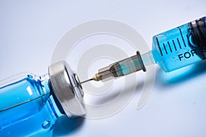 Close up vaccine vial dose flu shot drug needle syringe, medical concept vaccination hypodermic injection treatment, disease care