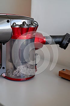 Close up vacuum cleaner with full of dusts. Extreme home cleaning