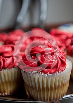 Close Up of Vanilla Cupcakes with Red Buttercream