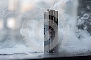 close-up of vaping device, with smoke and mist visible