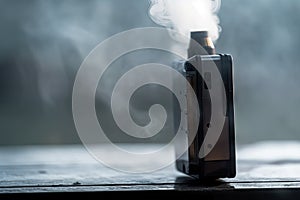 close-up of vaping device, with smoke and mist visible