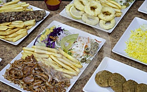 Close-up of variety of Middle Eastern dishes served in dishes seen