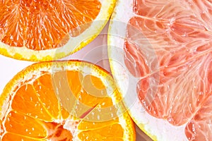 Close up of various citrus fruits - orange, mandarin and grapefruit.