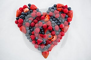 Close-up of various fruits forming a heart shape