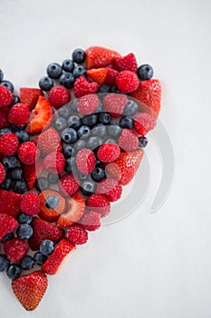 Close-up of various fruits forming a heart shape
