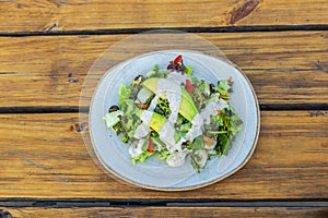 Close-up of a vegetable salad served on a plate in a restaurant