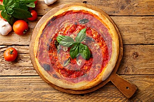top view vegetarian tomato pizza marinara on chopping board