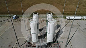 Close-up of vertical separators for cleaning compressed air and gas. The drone flies up to the storage tanks for gaseous