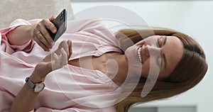 Close up vertical view woman texting sms using smartphone