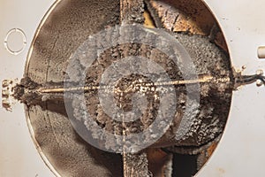 Close-up of a very dirty kitchen exhaust fan. Fan before preventive cleaning and washing