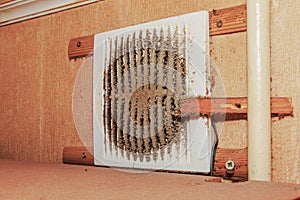 Close-up of a very dirty kitchen exhaust fan. Fan before preventive cleaning and washing