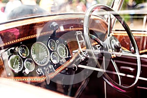 Close up of veteran car, dashboard, windshield, steering wheel