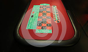 Close-up vibrant image of green casino table on black background photo