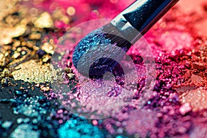 Close-up of a vibrant makeup brush with purple bristles covered in a mix of crushed eyeshadows