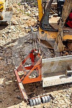 Close-up of a vibrating rack for placing concrete, mortar or asphalt. Tool for pouring the screed on the floor and leveling the