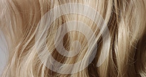 Close up video or woman`s blond hair