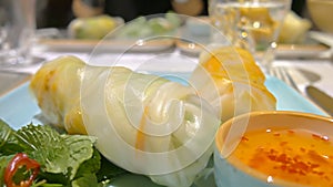 Close-up vietnamese spring rolls nem goi cuon on table in restaurant