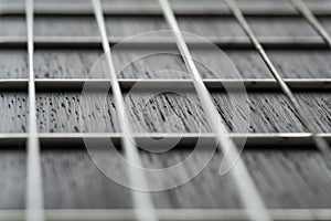 Close up view on acoustic guitar neck with strings