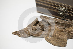 Close-up view of Agar wood : Oud, incense Chips, isolated on a background