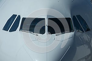 Close-up view of airplane nose in airport