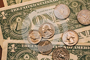 Close up view of American dollar bills and coins as background. Heap of American dollars for design.