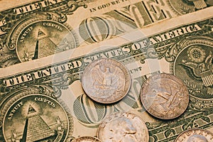 Close up view of American dollar bills and coins as background. Heap of American dollars for design.