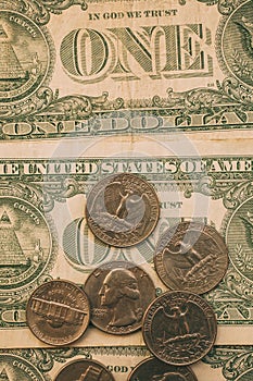 Close up view of American dollar bills and coins as background. Heap of American dollars for design.