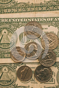 Close up view of American dollar bills and coins as background. Heap of American dollars for design.