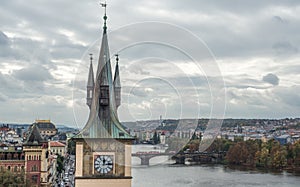 Close up view on ancient Old Town Water Tower and Vltava river, Prague, Czech Republic.