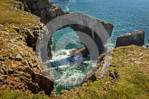A close-up view of the arch of the Green Bridge of Wales on the Pembrokeshire coast, Wales