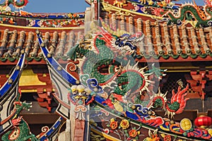 Close-up view of the architecture, traditional Chinese temple building with dragon statues in Tonghuai Temple, Guanyue Temple