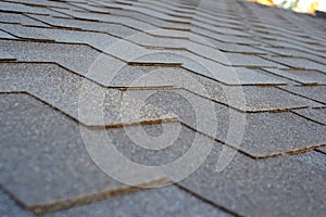 Close up view on asphalt roofing shingles.