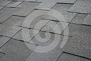 Close up view on asphalt roofing shingles.