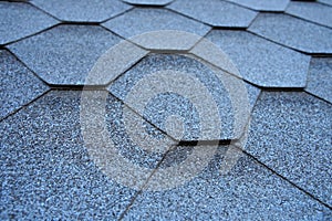 Close up view on asphalt roofing shingles.