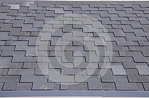 Close up view on Asphalt Roofing Shingles Background. Roof Shingles - Roofing.