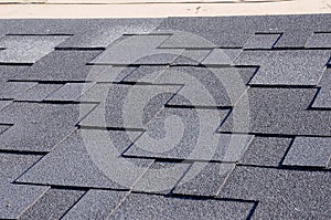 Close up view on Asphalt Roofing Shingles Background. Roof Shingles - Roofing.