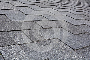 Close up view on Asphalt Roofing Shingles Background. Roof Shingles - Roofing.