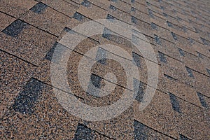 Close up view on Asphalt Roofing Shingles Background. Roof Shingles - Roofing.