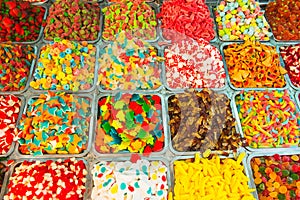 Close up view of assorted colorful different shape jelly candies on market place in Tel Aviv, Israel. Selective focus, space for t