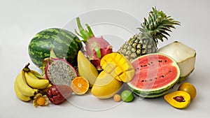 Close up view of assortment of exotic fruits and copy space on white background