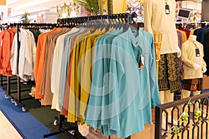 Close-up view of Baju Melayu on hangers for sale
