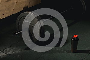 Close up view of barbell on floor in gym