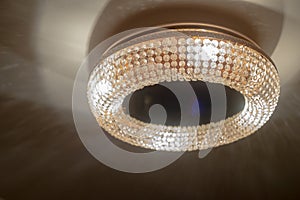 Large crystal chandelier glass refracts and reflects light