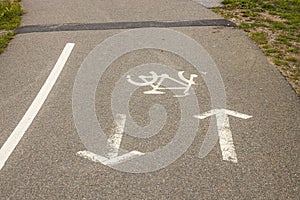 Close up view of bicycle road markings on asphalt.